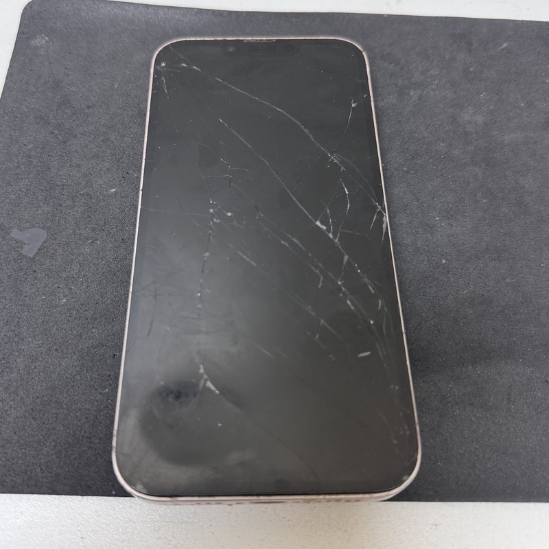 iPhone with a badly cracked screen before repair